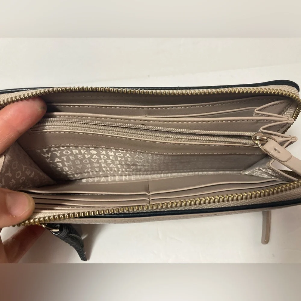 Kate Spade wallet pebble texture leather mauve color black trim tassel
